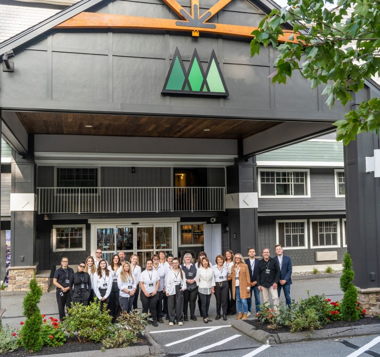 a group of people standing in front of a building