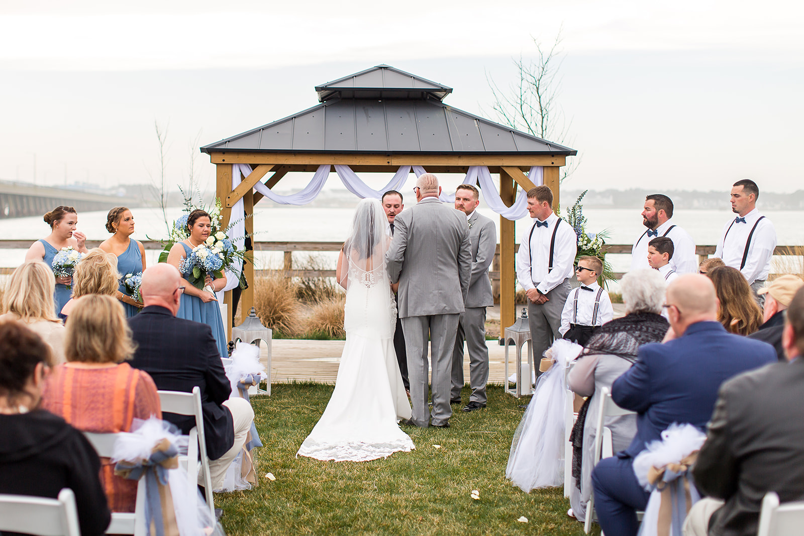 a bride and groom under a gazebo