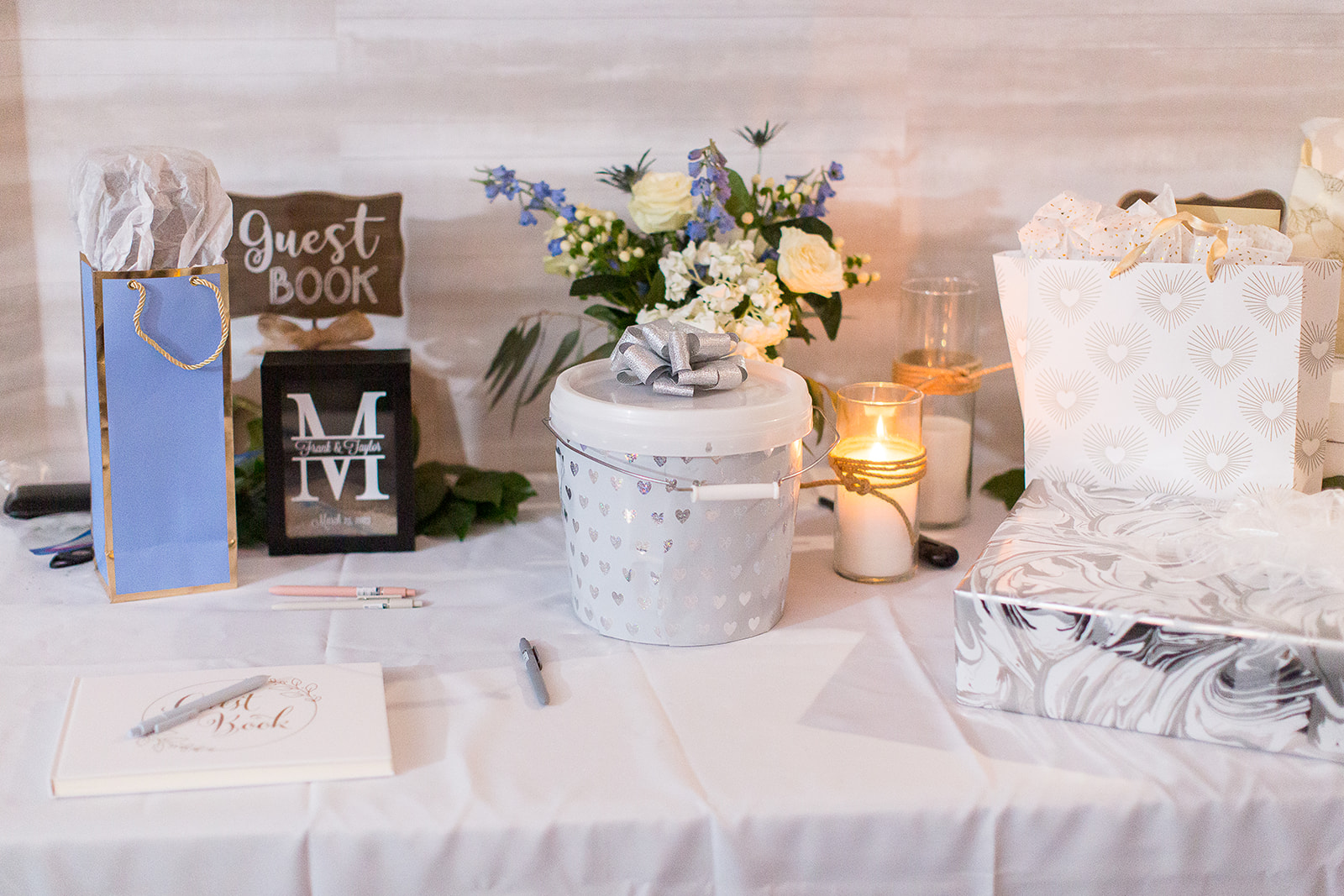 a table with a white tablecloth and flowers