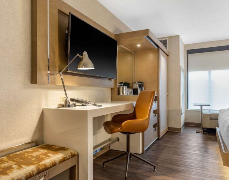 tv desk and chair in room
