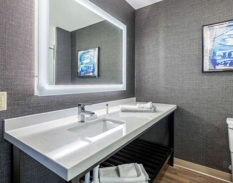 bathroom vanity with lighted mirror