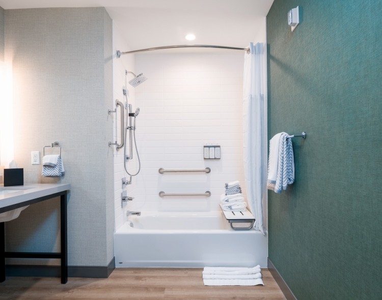 a bathroom with a shower and a sink