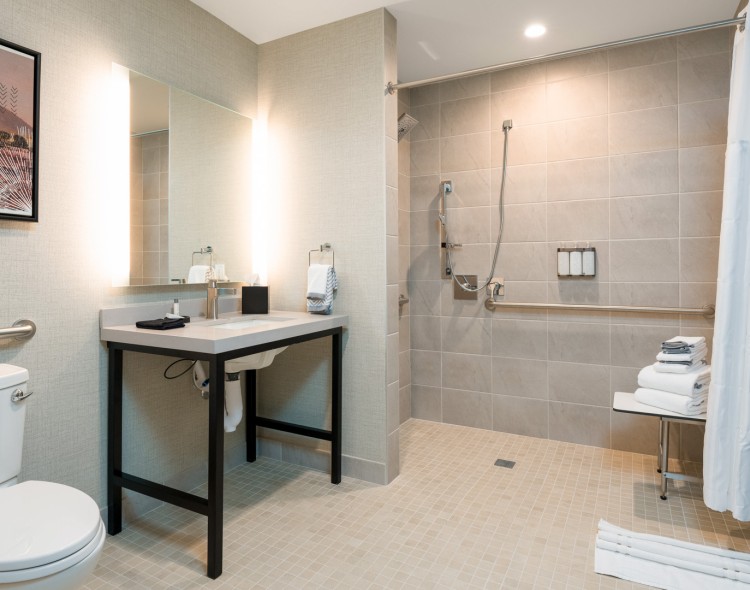 a bathroom with a sink and shower