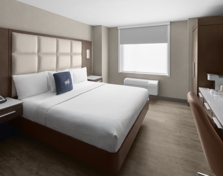 a room with a bed and a chair