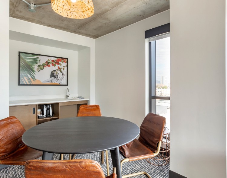 a table with 4 orange chairs