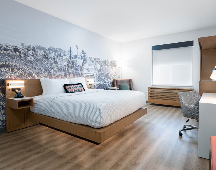 a room with a bed and a chair