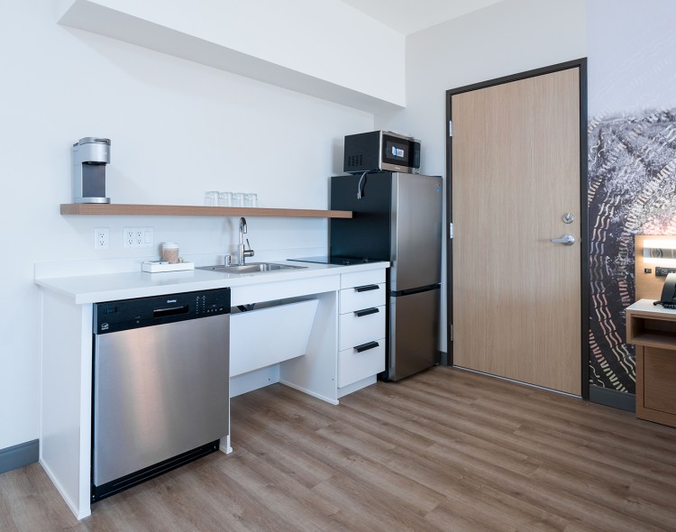 a kitchen with a sink and refrigerator