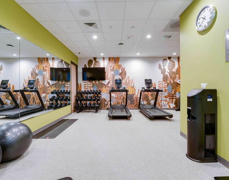 a room with treadmills and exercise equipment
