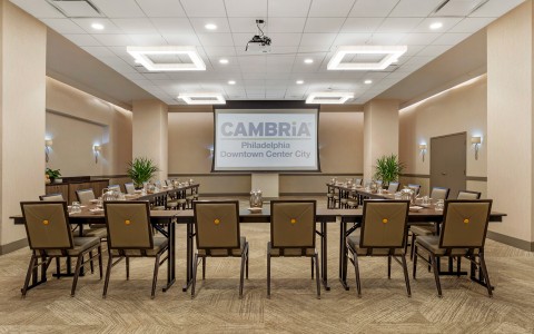a room with a large table and chairs