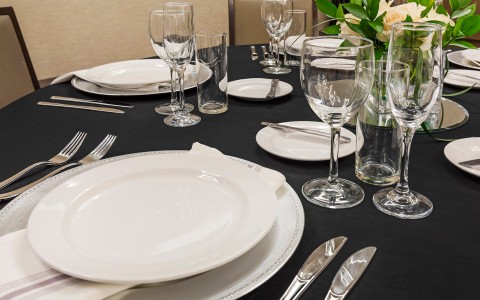 a table set with plates and glasses