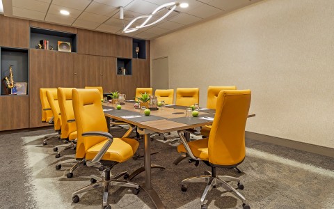 a conference room with a table and chairs