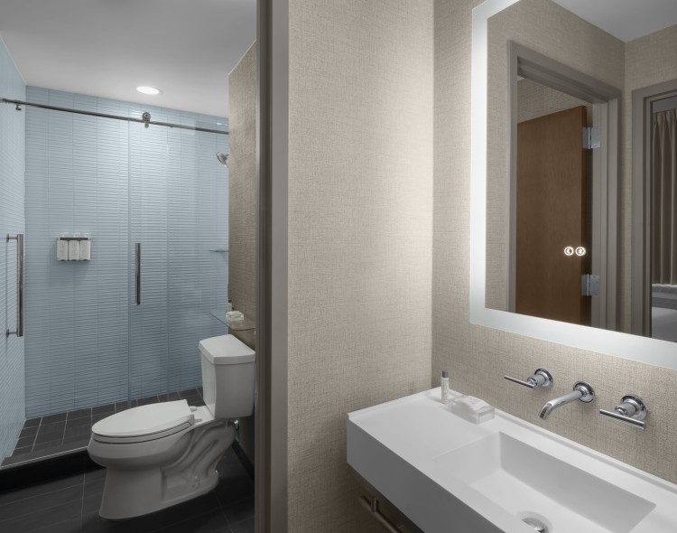 a bathroom with a mirror and sink