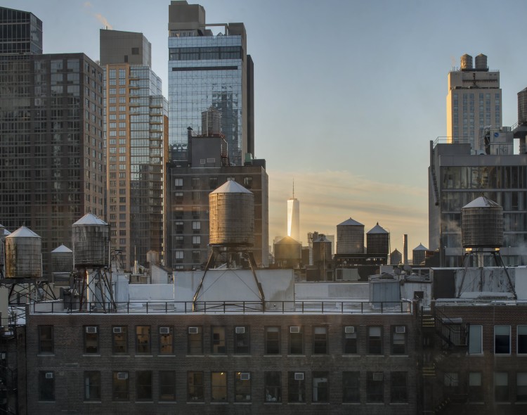 a city skyline with water towers