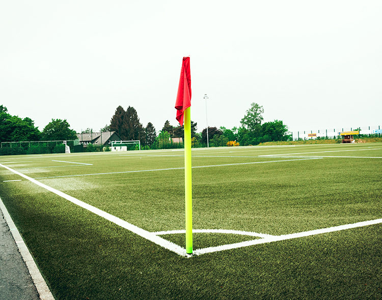 soccer field in park with flag in ground
