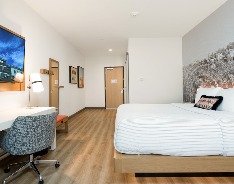a room with a bed and desk