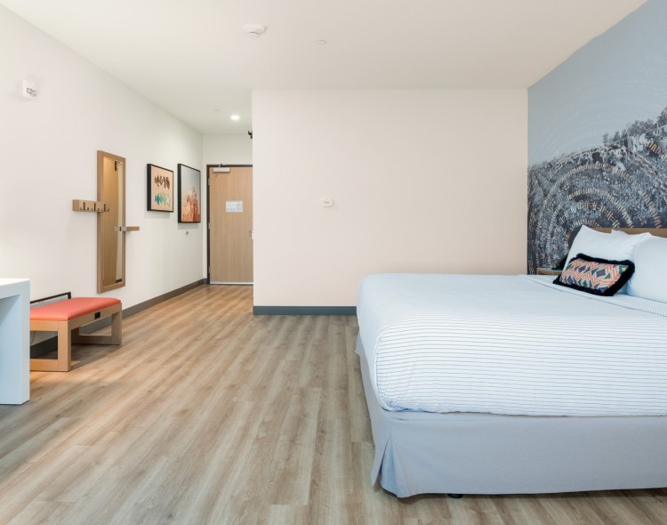 a room with a bed and a chair