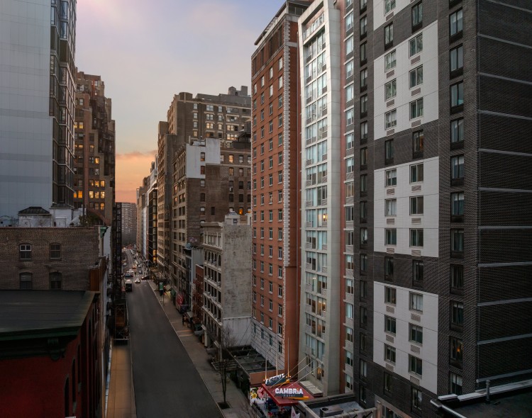 a city street with many tall buildings