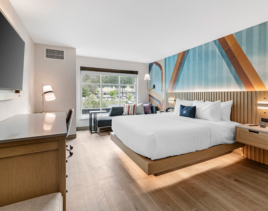 a room with a bed and a desk