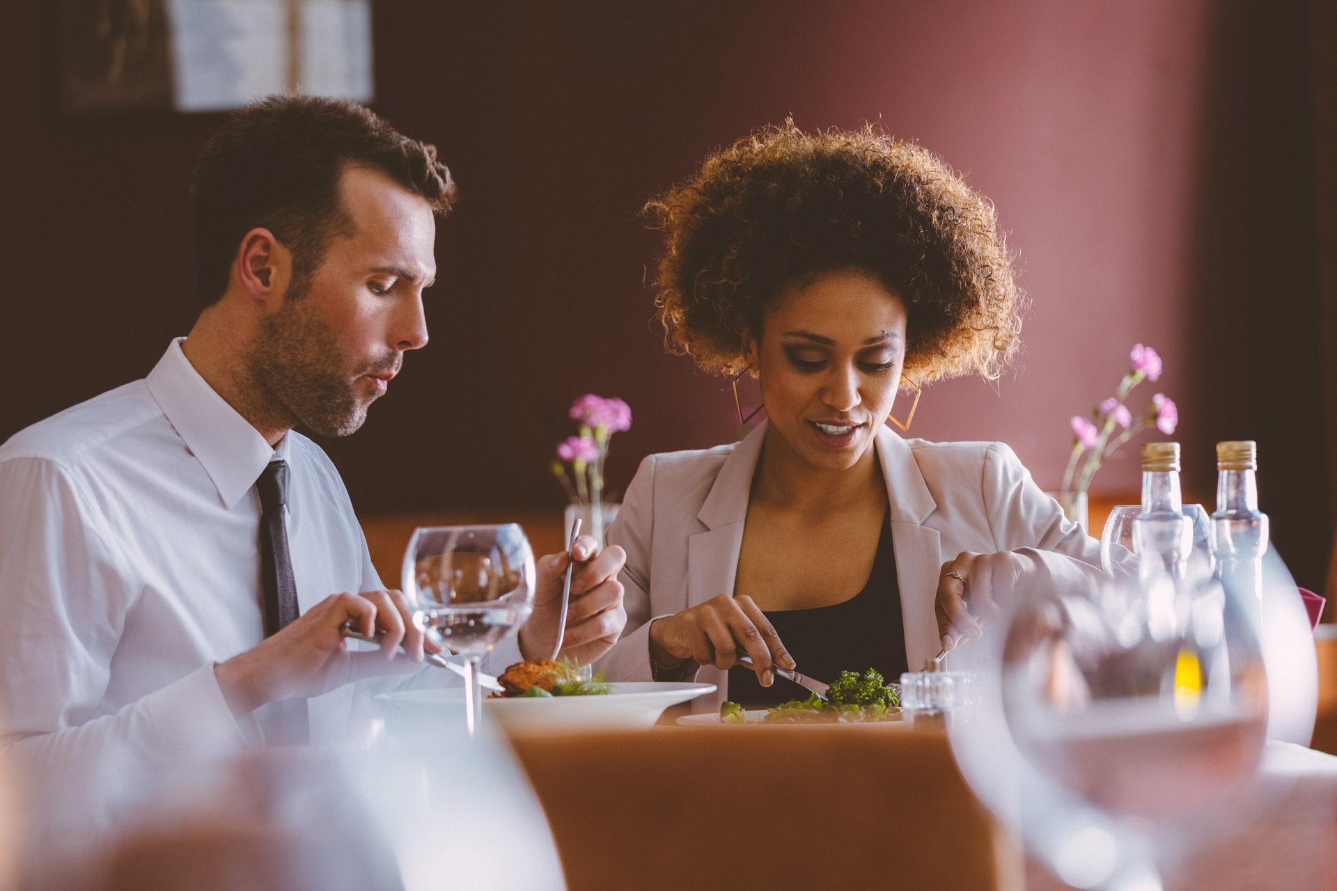 A man and woman having dinner