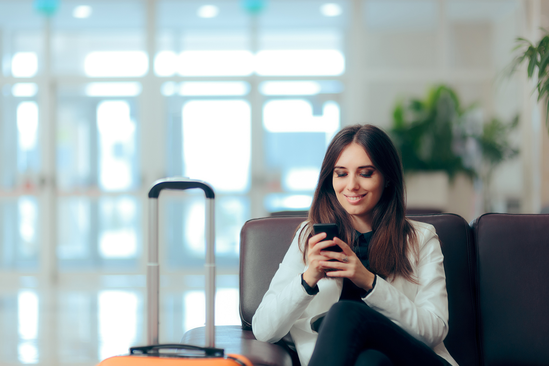 Woman at the airport on her phone