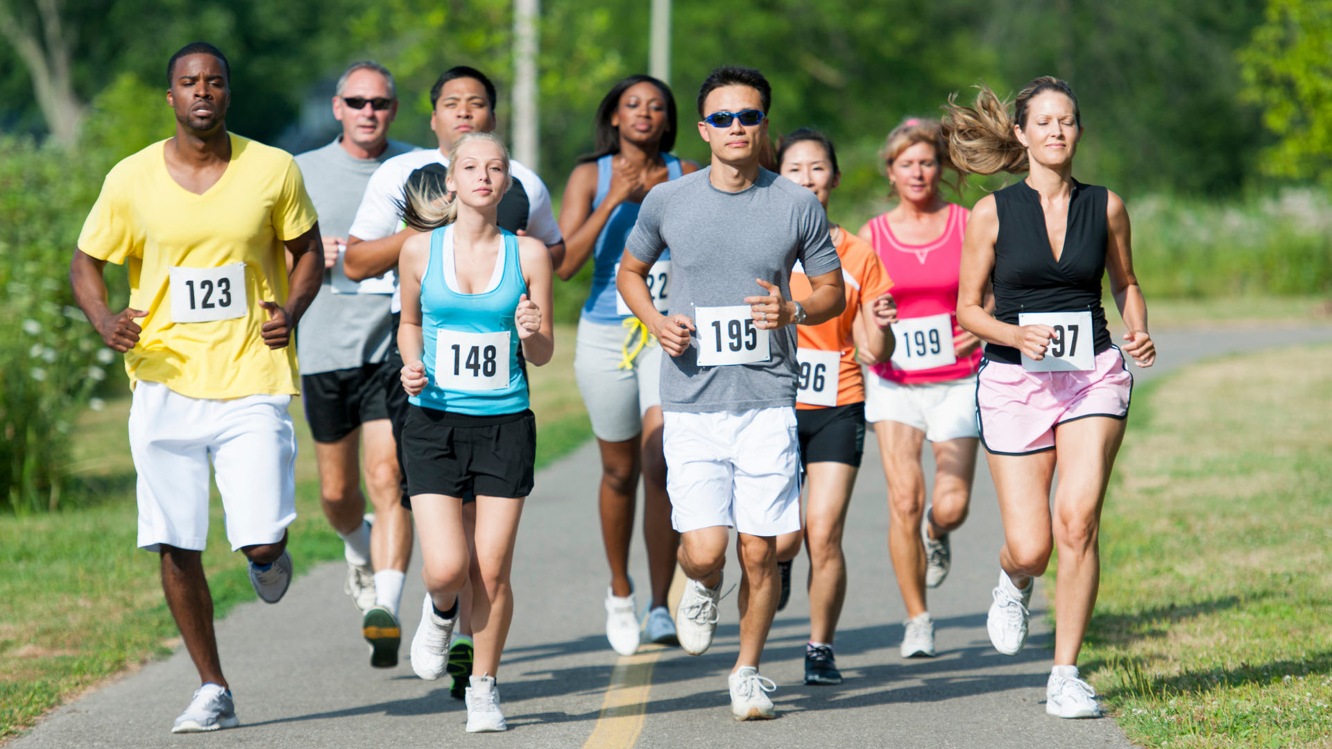 a group of people running on a road