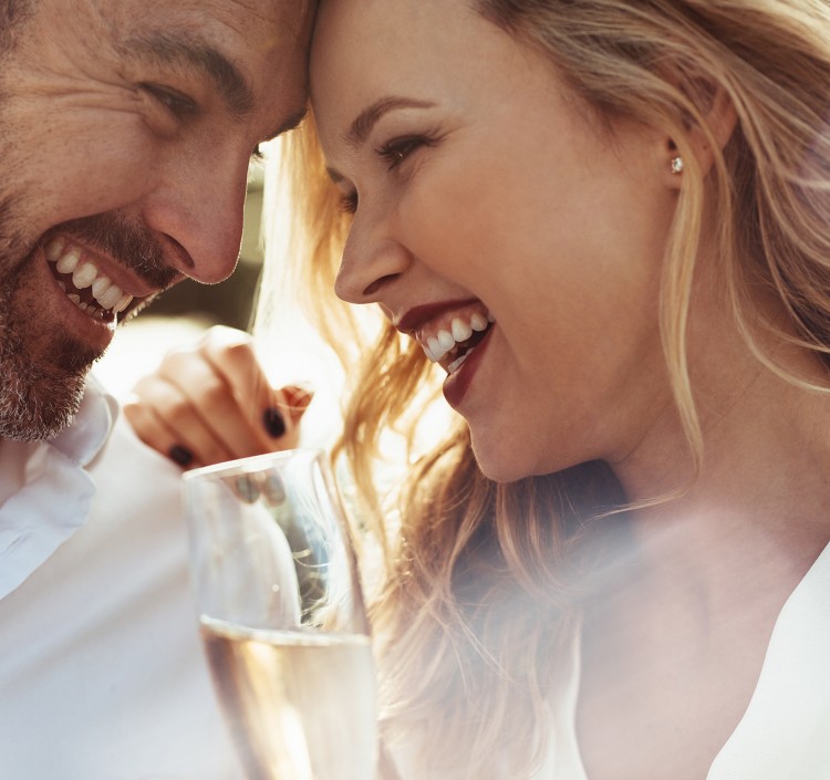 woman and man face to face and smiling