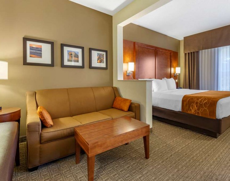 a guest suite with a living space and a bedroom
