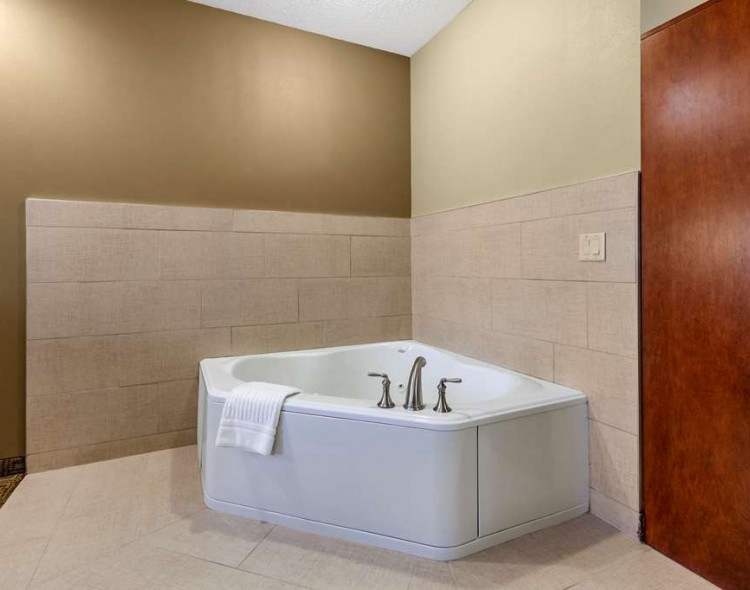 a king suite with a hot tub