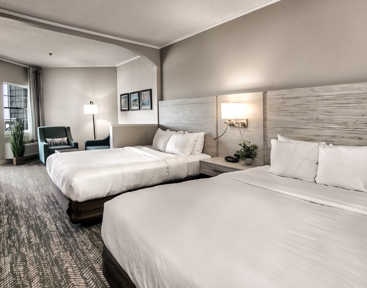 double queen bedroom suite in white and gray accents