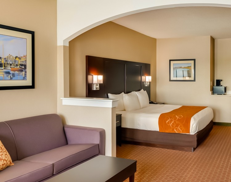 premium queen bedroom in orange and pale accents