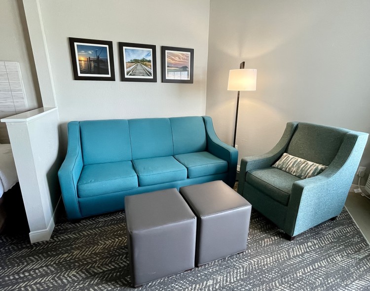 blue sofa and green arm chair of a living room
