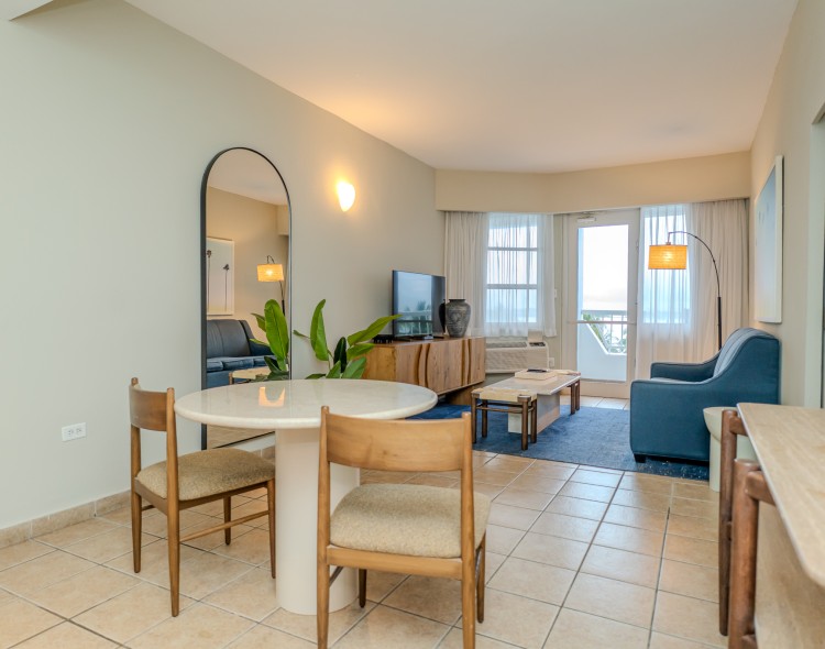 a room with a table and chairs