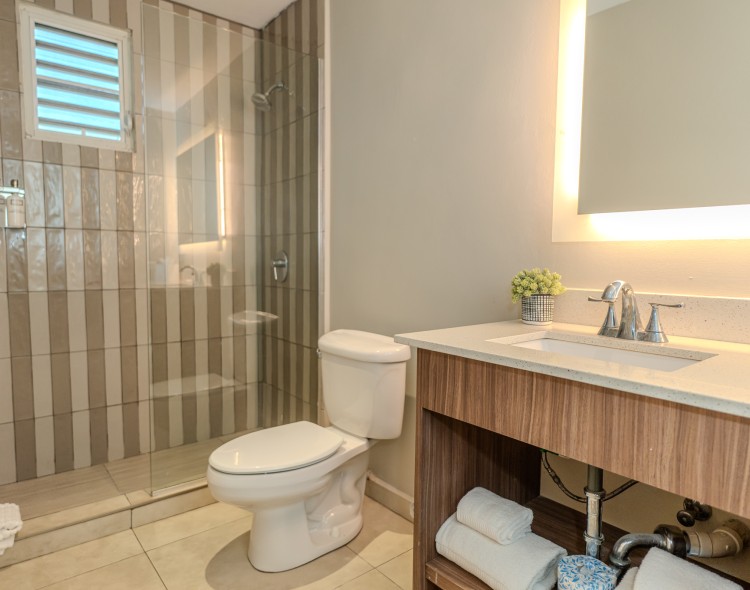 a bathroom with a glass shower door