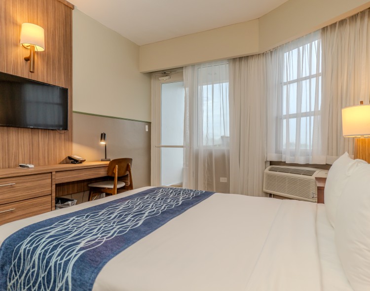 a room with a bed and a desk