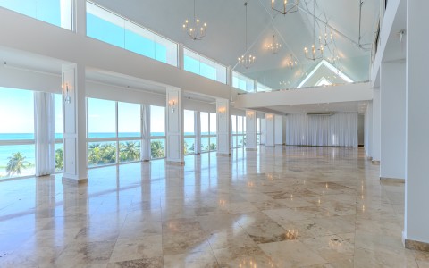 a large room with large windows and a large ceiling