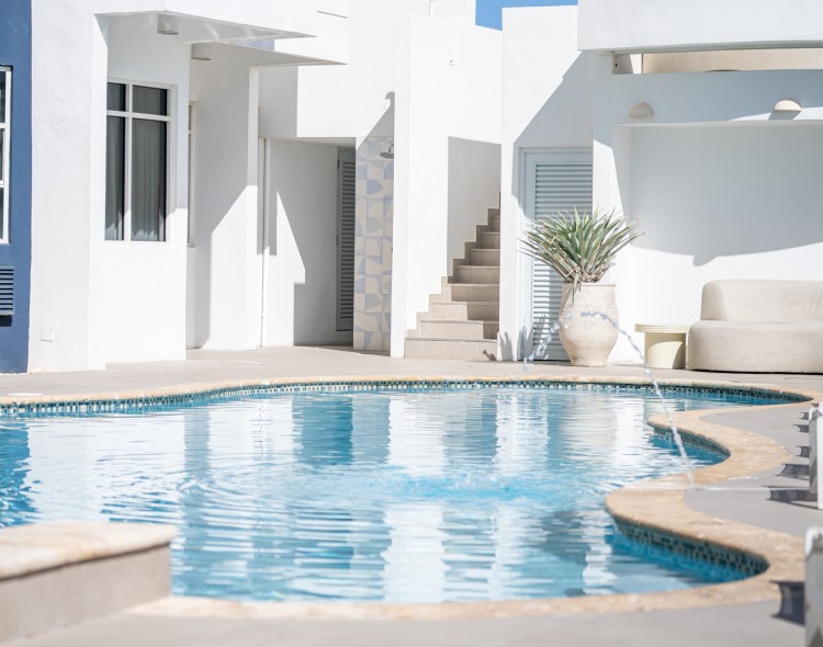 a swimming pool in a white building