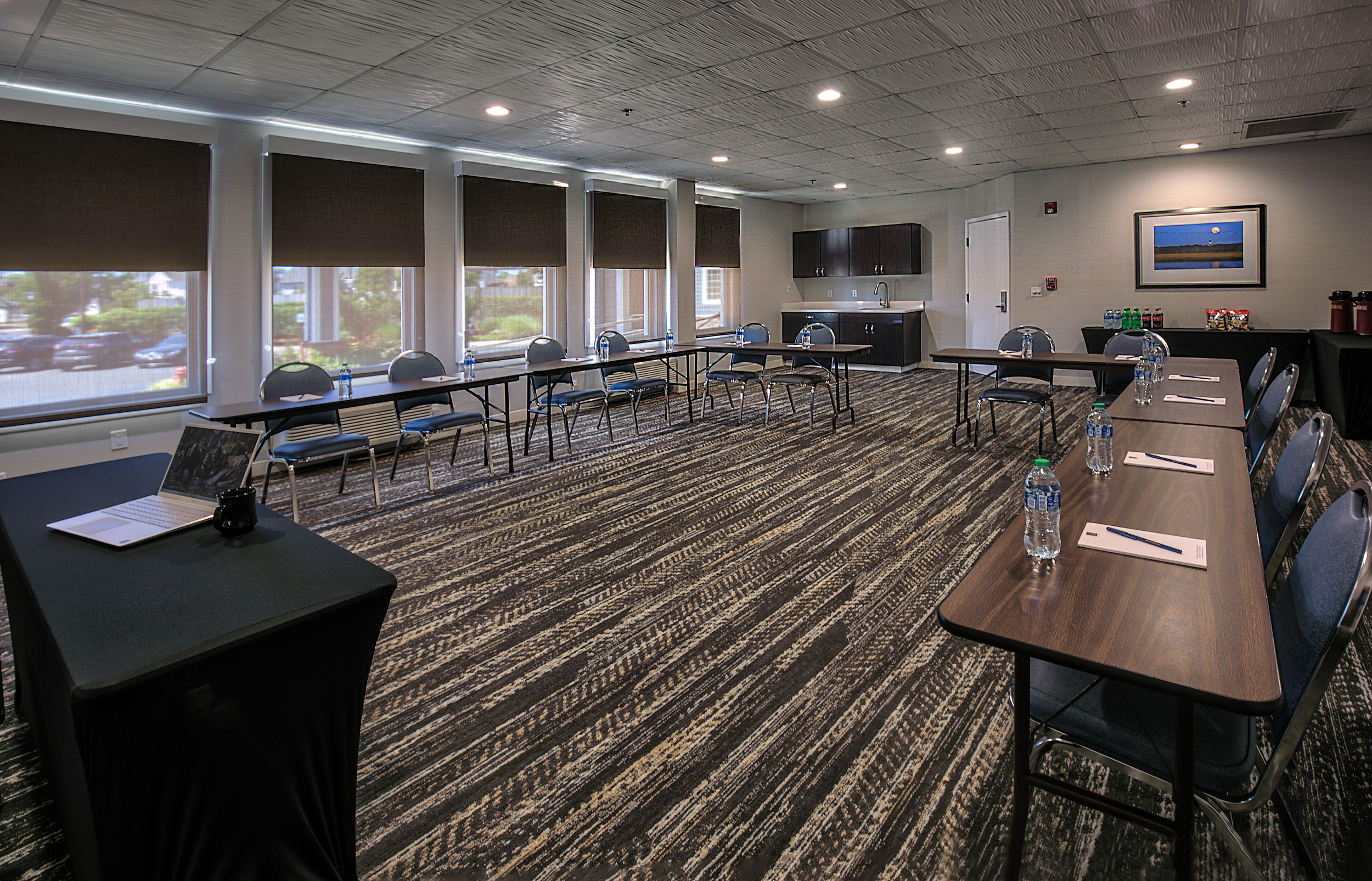 meetings room with tables set up in u