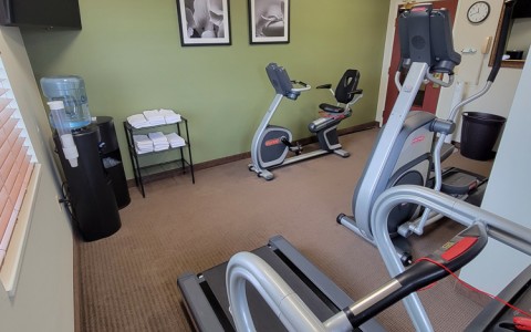 fitness center with machines and towel station