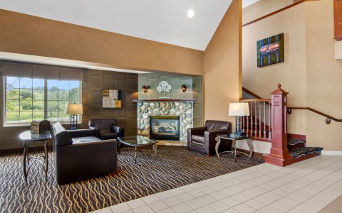 a living room with a fireplace and couches