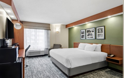 a room with a bed and a chair