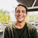 a man smiling at the camera