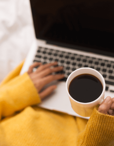 a person holding a cup of coffee