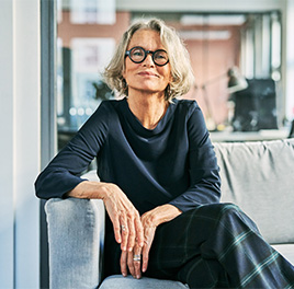 a woman sitting on a couch