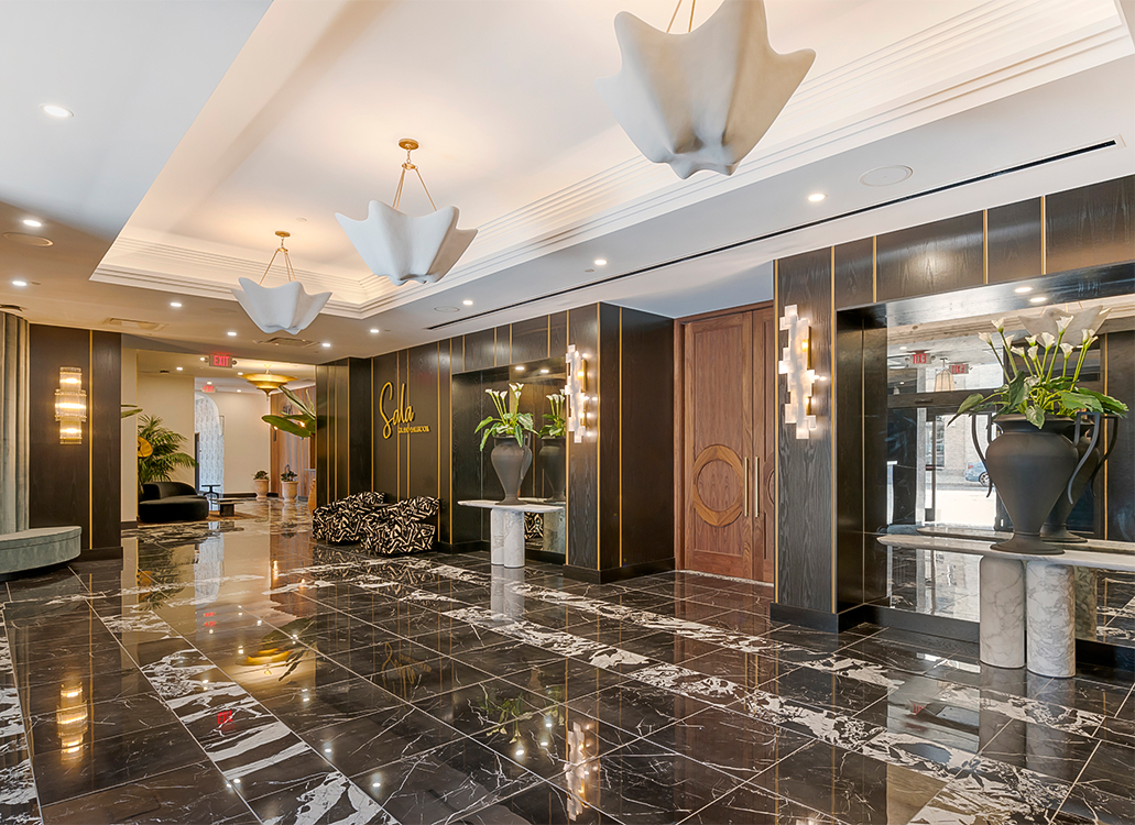 a room with light fixtures and black and white floors