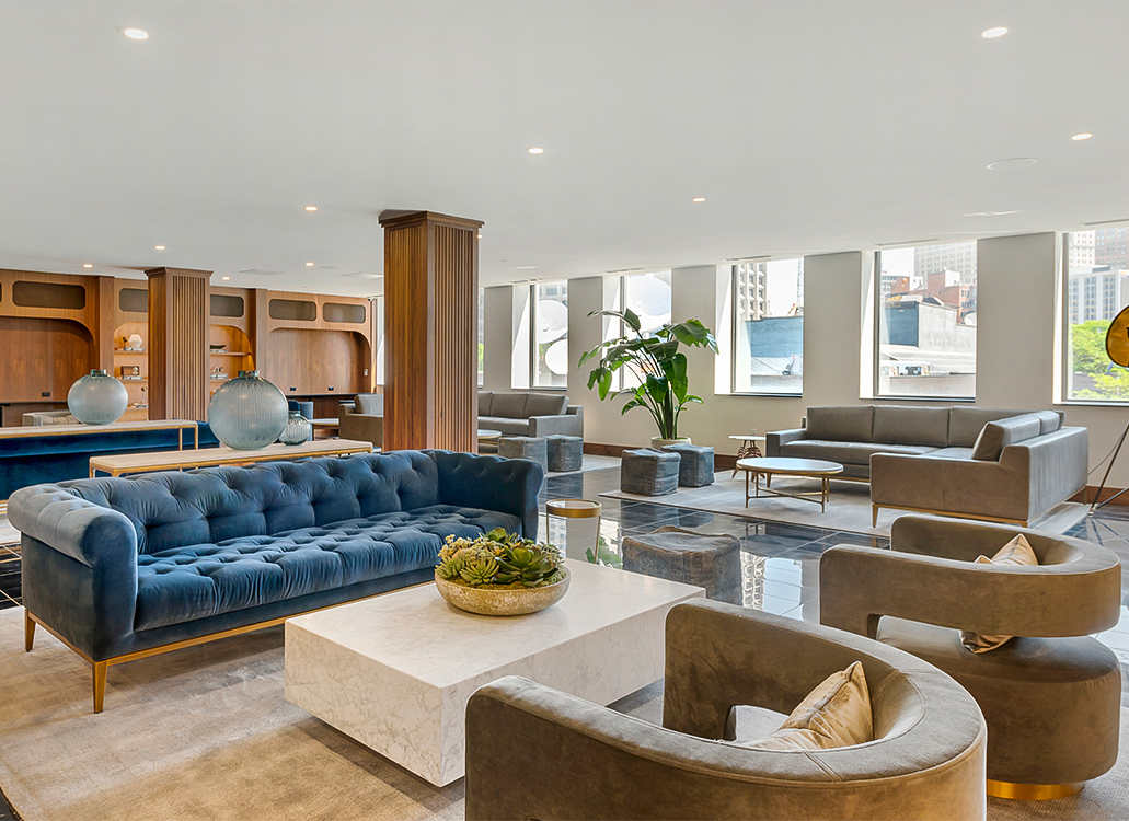 a lobby with couches and tables