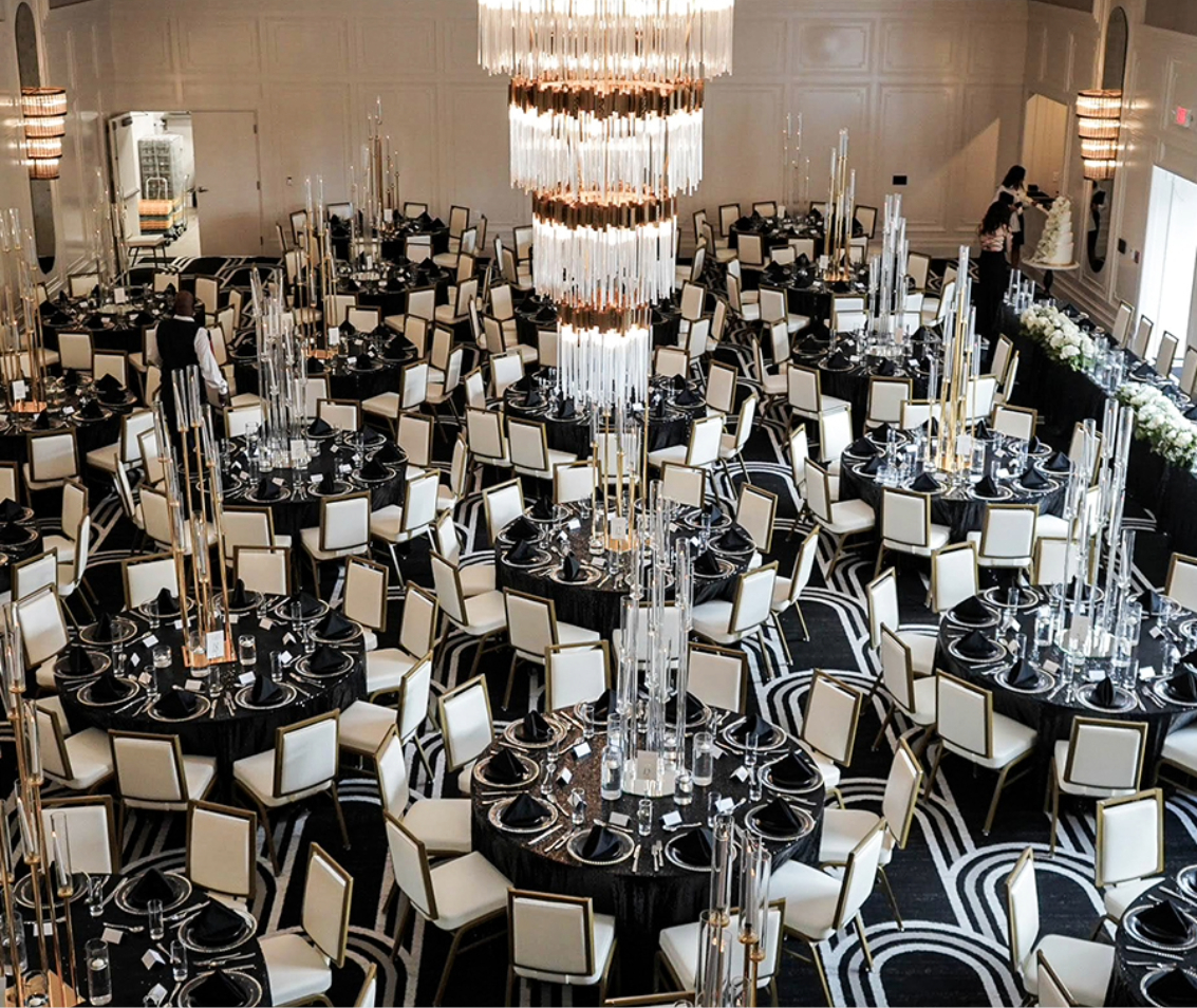 a large group of tables set up in a room