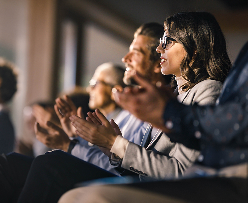 a group of people clapping