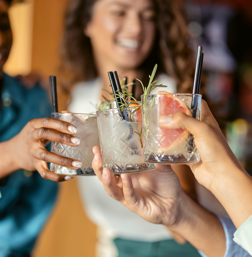 a group of people holding drinks
