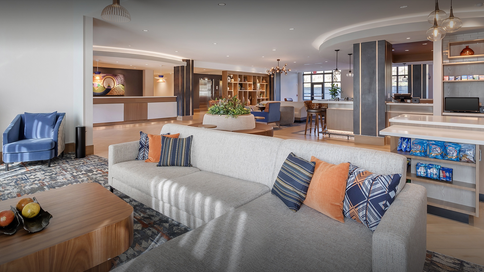 a large room with a couch and a table