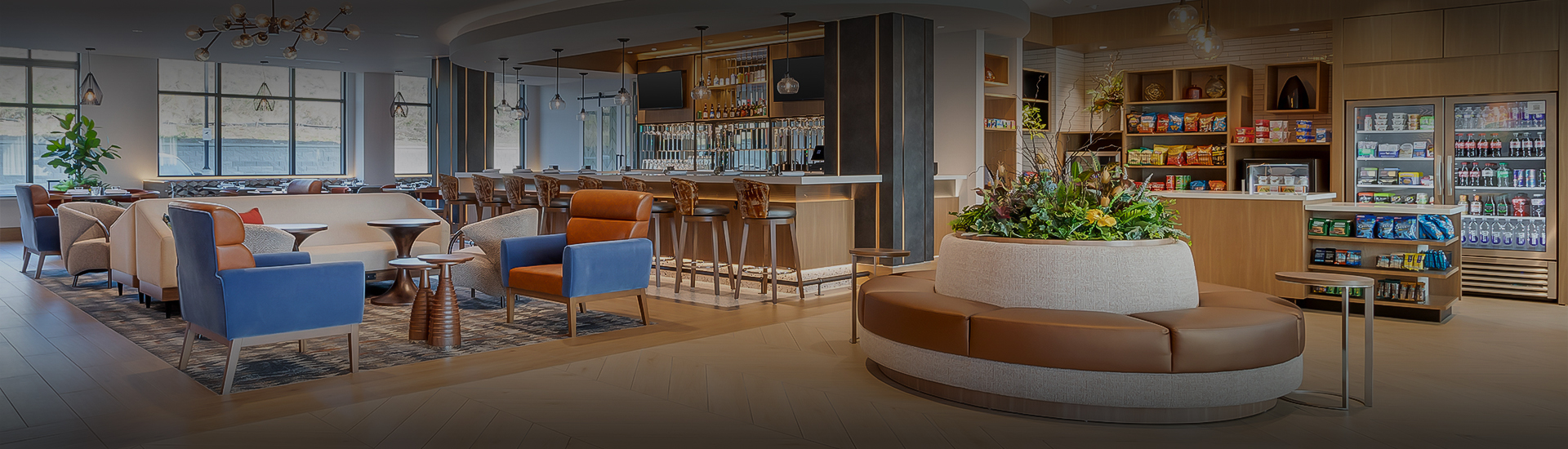 a bar with chairs and a counter